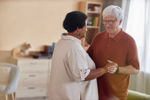 istock Senior Couple Dancing in Hazy Room with Smiles 2191411155