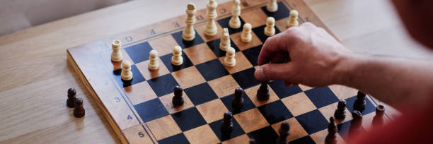 istock Close Up of Man Playing Chess 2191411231