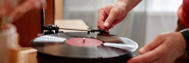 istock Senior Man Setting Up Retro Record Player at Home 2191411233