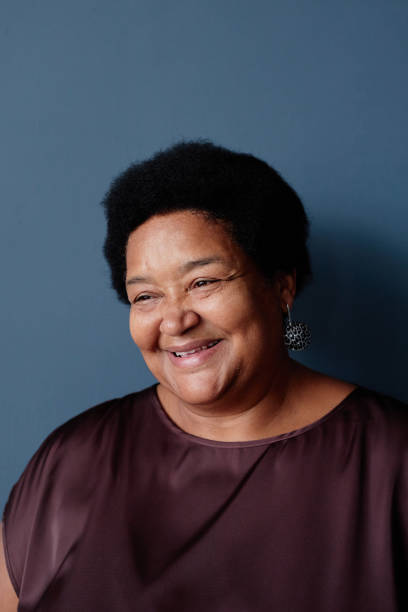 istock Smiling Senior African American Woman on Blue 2191411248