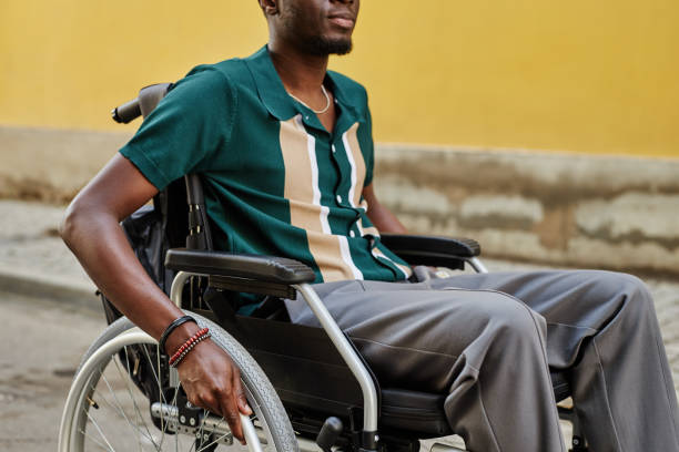 istock Smiling Black Man using Wheelchair on Yellow 2191411465