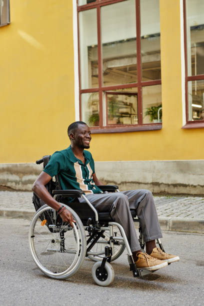 istock Happy Black Man with Disability Moving in City 2191411468