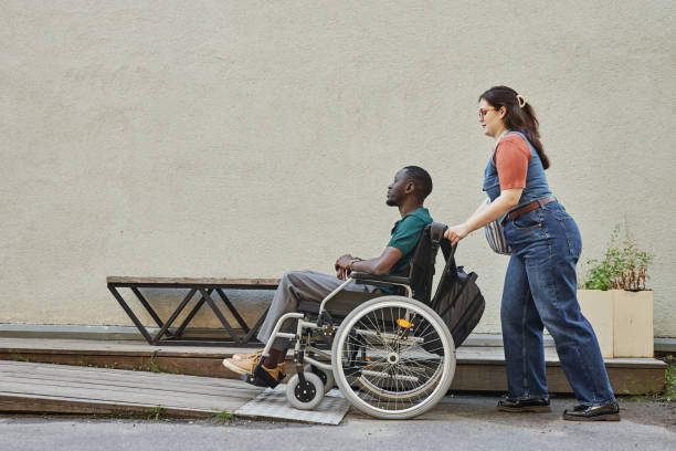 istock Black Man with Disability on Ramp with Friend 2191411471