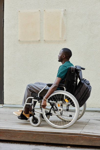 istock Black Man using Wheelchair in City 2191411477
