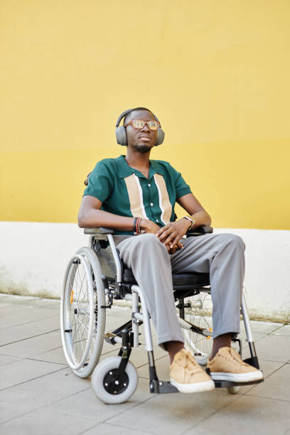 istock Black Man using Wheelchair Listening To Music 2191411504