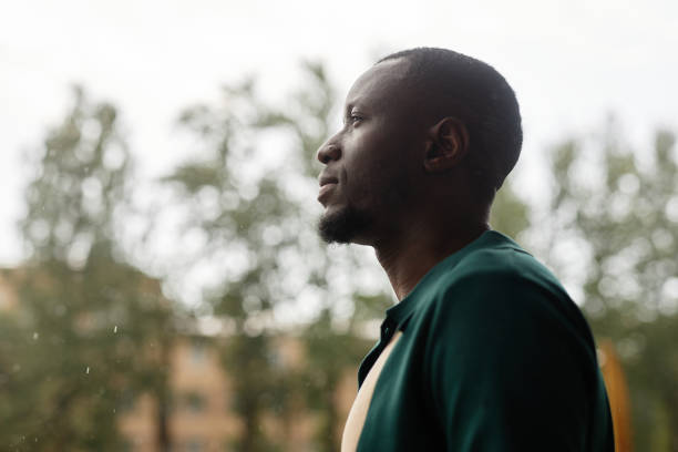 istock Black Man Looking Out in Street 2191411543