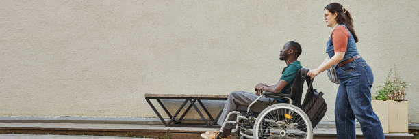 istock Black Man with Disability on Ramp with Friend 2191411576
