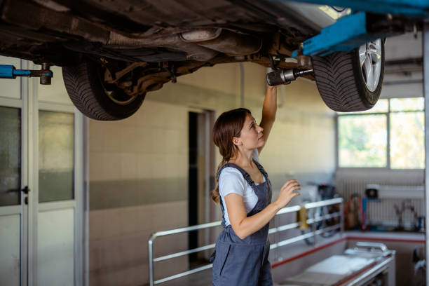 istock Professional Female Mechanic in Her Workshop Fixing a Vehicle 2191413887