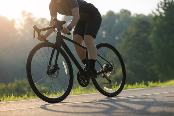 istock Woman cycling on summer park trail 2191414792
