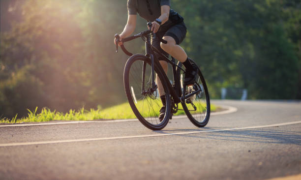 istock Woman cycling on summer park trail 2191415076