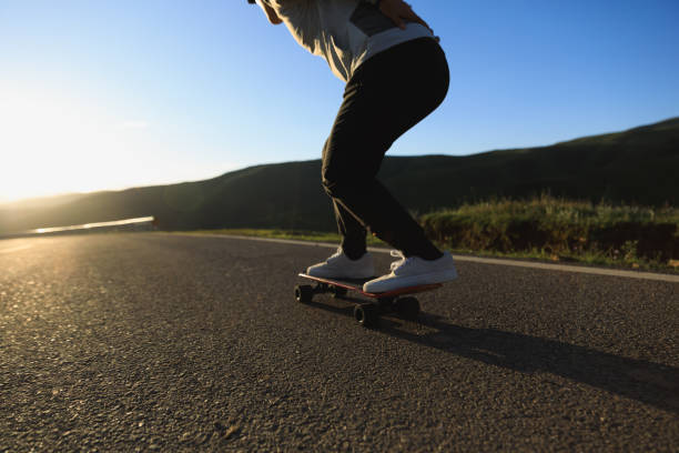 istock Skateboarder skateboarding on the mountain road 2191416733