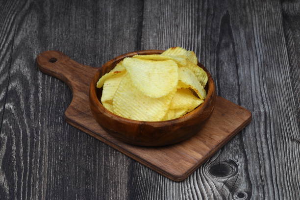 istock potato chip isolated on white background close up 2191418751