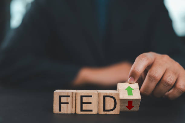 istock Fed rate hike to curb inflation, Central banking system and interest rate changes. wooden block with FED and up-down arrows icon. 2191419616