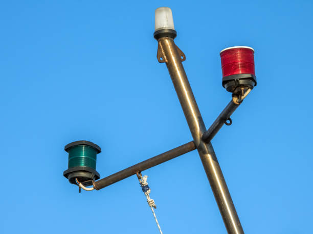 French And French Polynesia Flags Flying From Ferry Boat Mast With Blue Sky And White Clouds