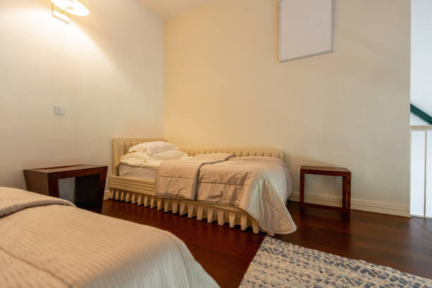 Bedroom interior with white beddings in apartment, nobody