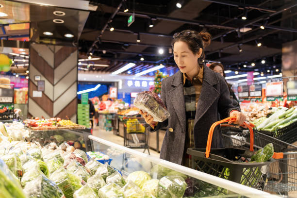 istock Joyful Grocery Shopping Experience with Fresh Vegetables and Produce 2191423870