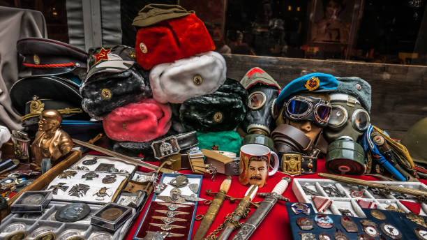 Budapest, Hungary - March 1 2020: Stalls overflow with vintage military items in a vibrant Budapest market. Hats, medals, and memorabilia reflect the rich history and nostalgia of the past, attracting curious shoppers.