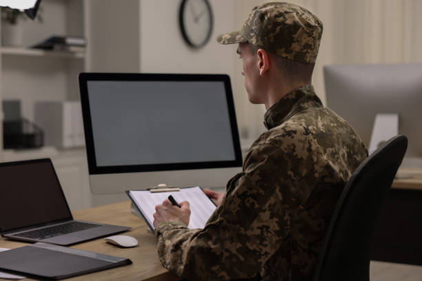 istock Military service. Soldier with clipboard working at table in office 2191428611