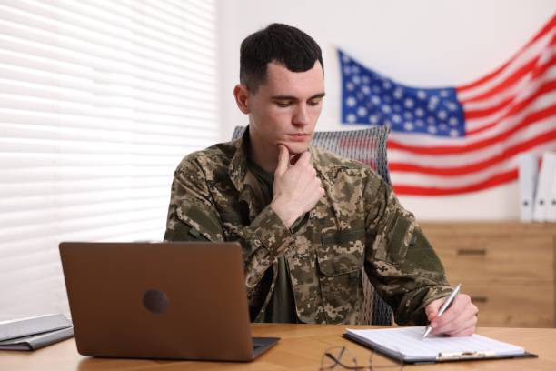 istock Military service. Young soldier working at table in office 2191428616