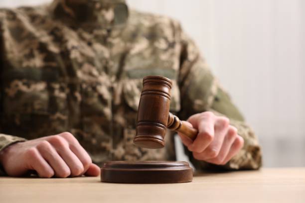 istock Law concept. Man in military uniform with gavel at table, closeup. Space for text 2191428629