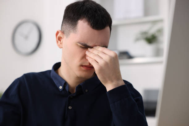 istock Young man suffering from headache in office, space for text 2191428686