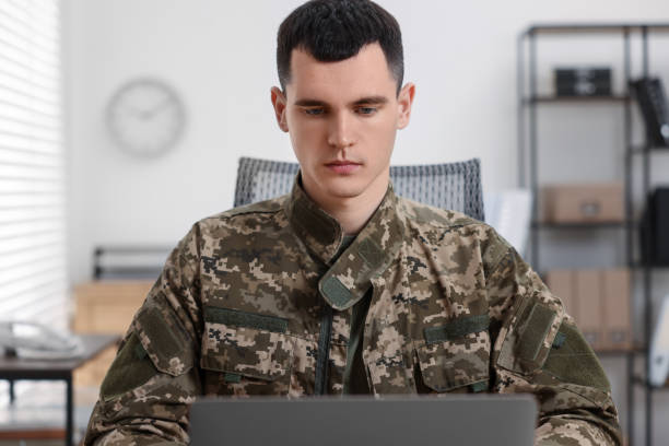 istock Military service. Young soldier working in office 2191428705