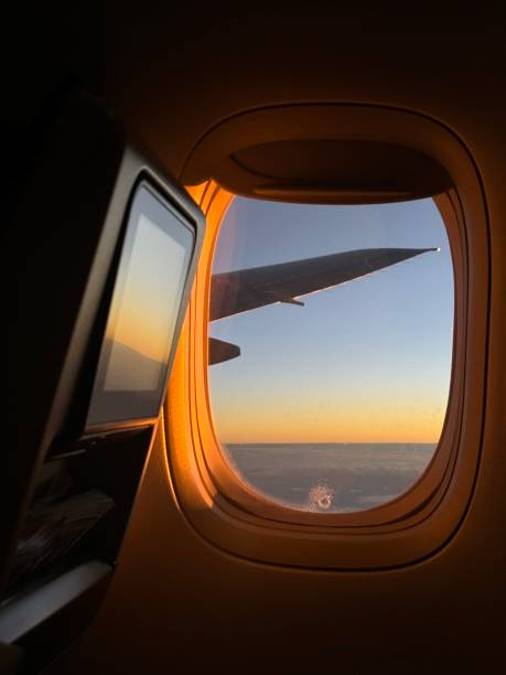 istock Airplane window seat at sunset 2191430622