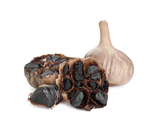 istock Organic fermented black garlic isolated on white 2191432694