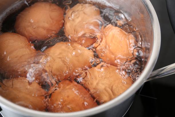 istock Chicken eggs boiling in pot, closeup view 2191434175