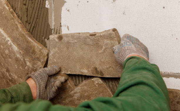 istock A person is laying bricks on a wall 2191434236