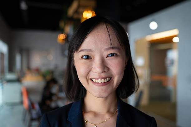 istock Young business woman smiling and looking at camera 2191436089