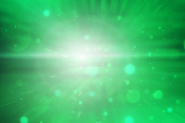 istock green background with blurry lights and flash of light. festive background for St. Patrick's day 2191437698
