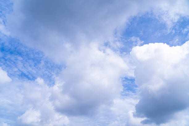 The sky background has dense white clouds on a bright day. Beautiful sky.