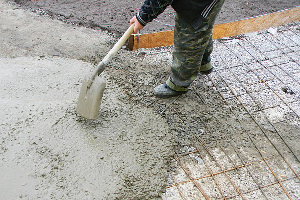 istock Concrete pavement base with reinforcement. This is done by laying down a sub-base, a layer of aggregate material that is placed above the subgrade to prevent soil displacement. Pavement Foundation. 2191442482