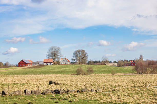 istock Farmstead on a hill in a beautiful rural spring landscape 2191443404