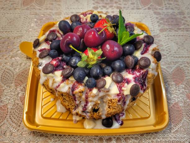 artisanal sweet bread panettone with dough made with whole wheat flour, fruits and dried fruits, vanilla extract, spices, orange juice and zest filled with organic red fruit jelly
