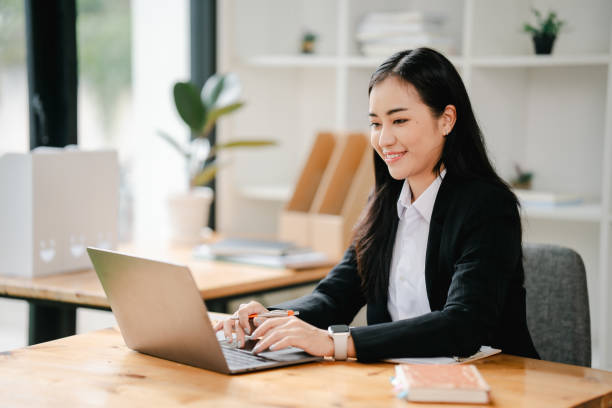 istock Asian business woman Working at the office with documents on the table Planning to analyze financial reports business plan investment financial analysis concepts 2191449026