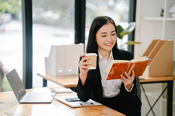 istock Asian business woman Working at the office with documents on the table Planning to analyze financial reports business plan investment financial analysis concepts 2191449058