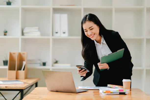 istock Asian business woman Working at the office with documents on the table Planning to analyze financial reports business plan investment financial analysis concepts 2191449163
