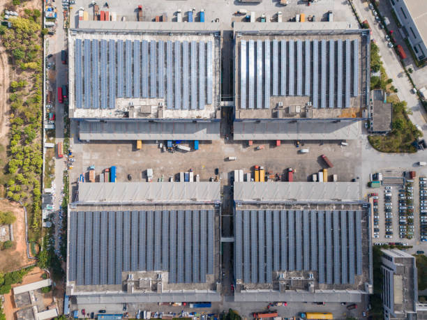 istock Modern logistics park rooftop solar panels and parked trucks 2191449573