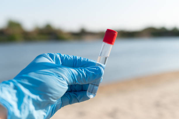 Testing water on river beach, toxic, polluted water, no swimming in river