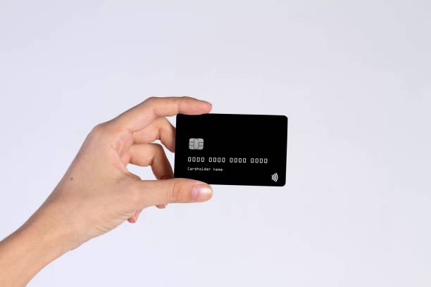 istock Hand holding black credit card 2191452439