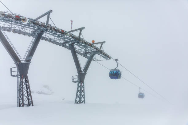 A deep mist on the mountain ski slope of the Alps