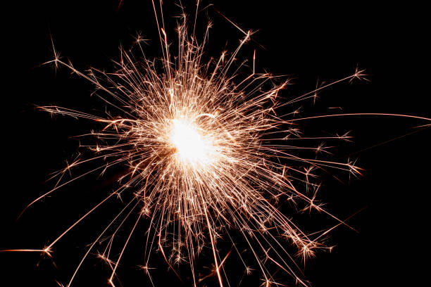istock New Year's Eve celebration, sparkler spark 2191453883