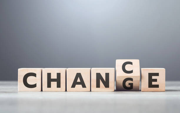 istock Man selects between the words 'CHANGE' and 'CHANCE' on wooden blocks, symbolizing the decision-making process and embracing opportunities for growth 2191454545