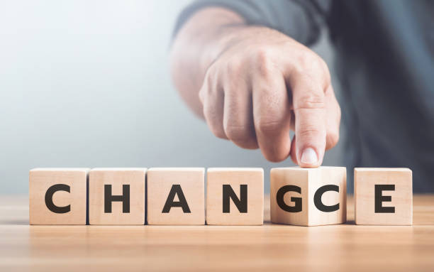 istock Man selects between the words 'CHANGE' and 'CHANCE' on wooden blocks, symbolizing the decision-making process and embracing opportunities for growth 2191454549