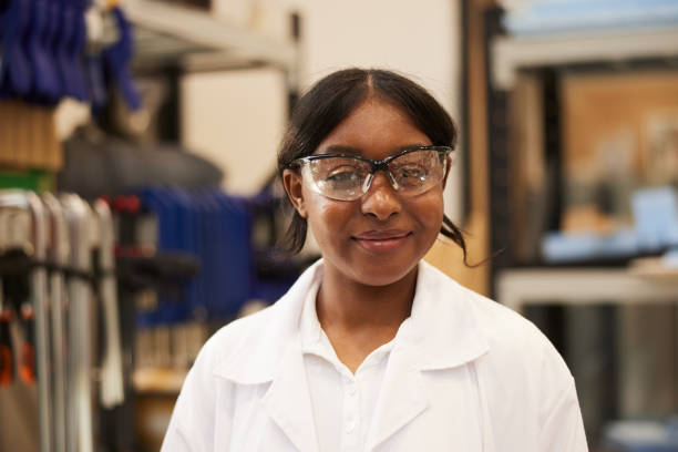 istock With a smile, the young vocational trainee poses in the workshop, ready to tackle the next task. 2191456053