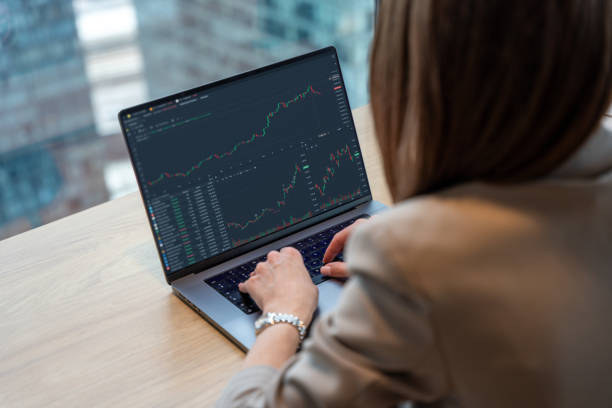 istock Professional Woman Analyzing Financial Data on a Laptop in Modern Workplace 2191457458