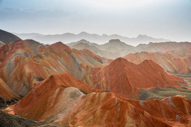 Zhangye Danxia National Geopark, Gansu, China. Colorful landscape of rainbow mountains. Walking paths around sandstone rock formation at Zhangye National Geological Park.
