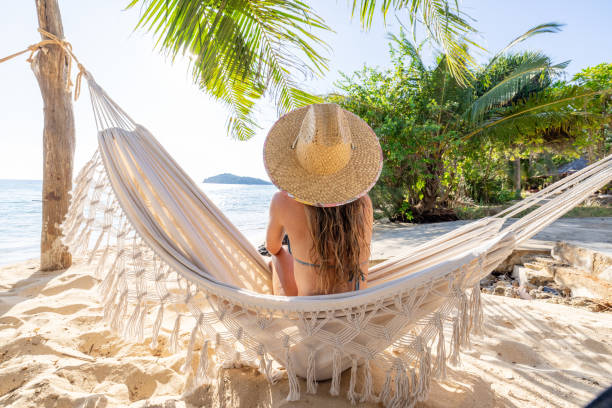 Woman Relaxing in Hammock on Tropical Beach